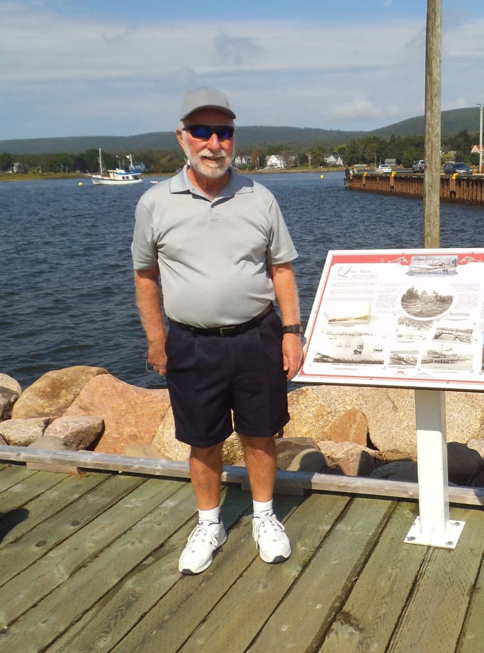 Read the plaques along the boardwalk for the history of the Acadians at Annapolis Royal. Here's my husband next to a plaque about his 6th great-grandfather.