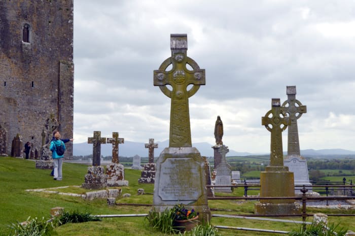 The castle known as Rock of Cashel dominates the countryside. The cemetery adds a somber air.