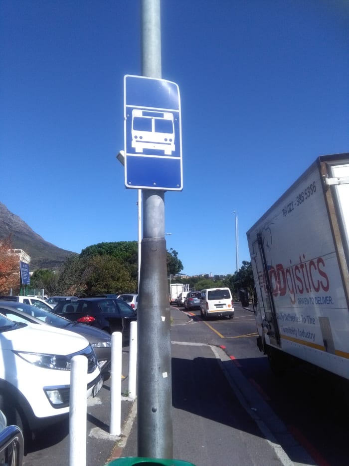 This blue signpost indicates it is an area in which the bus will stop. Sometimes there is just a number of it.