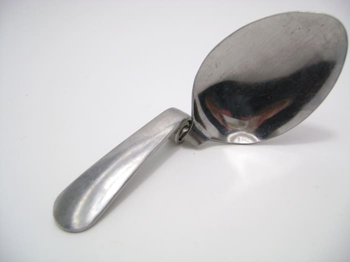 Now try to unbend the spoon using your strength. You'll see it's much harder than it looks!