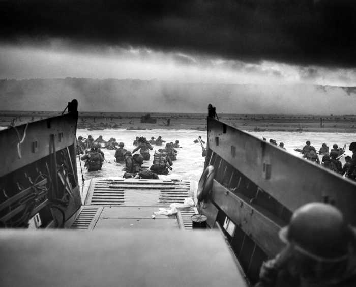 Men of the US 1st Infantry Division wading ashore on Omaha Beach