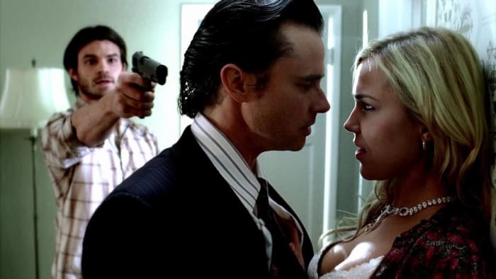 Daniel Gillies (Elijah) and Arielle Kebbel (Lexi) on an episode of True Blood, alongside Sam Trammell (center).