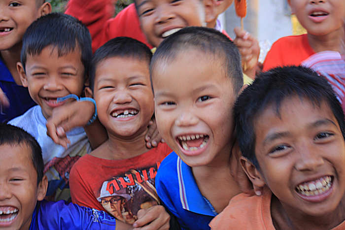 Children unable to resist the temptation to get their faces in on the picture