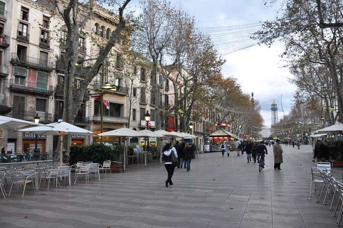La Rambla is a street in central Barcelona, popular with both tourists and locals alike. A 1.2 kilometer-long tree-lined pedestrian mall in the Barri Gtic, it connects Plaa Catalunya in the center with the Christopher Columbus monument at Port Vell.