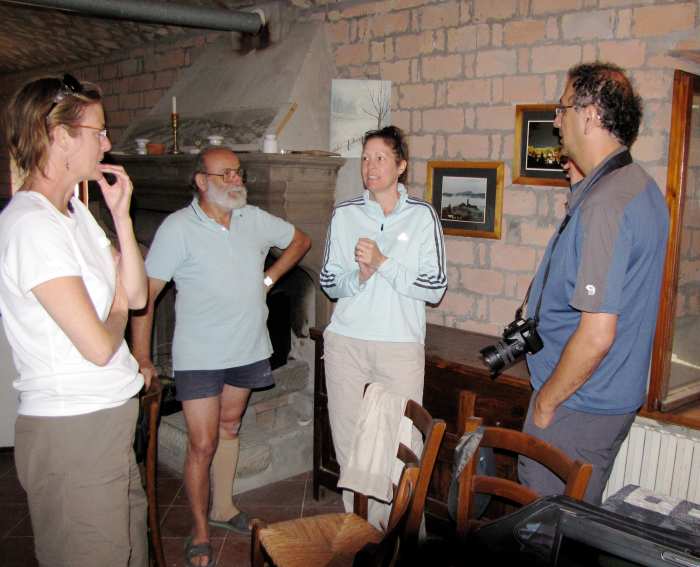 The gentleman to the left invited us into his home to show us his pictures on the wall.