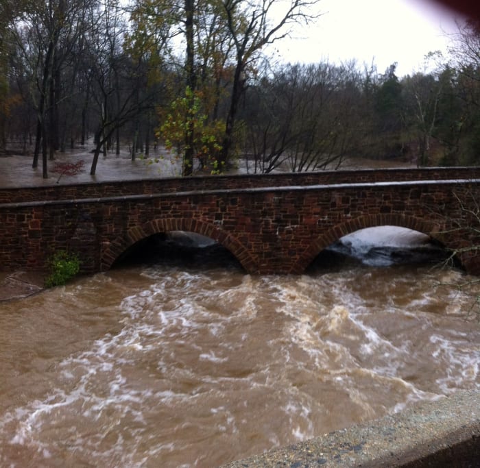 Late in 2012, a powerful storm hit Northern Virginia. Unlike most people, who hunkered down in their homes, we went to see what the tremendous rain did to Stone Bridge. Forgive the quality. This shot was taken with the iPhone.