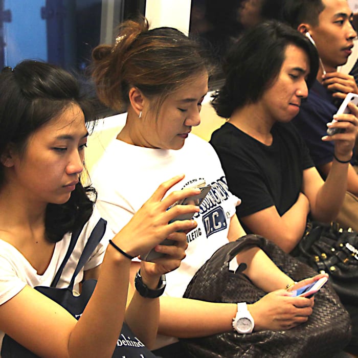 Like everyone in the modern world, commuting Thais are addicted to texting, music playing and gaming on their teeny-weeny cellphone computers. And like everyone else, that often takes precedence over actual social contact