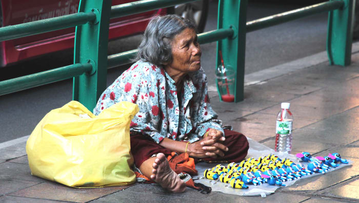 Some will do what they can to earn a few coins on the street. This lady was selling key rings for 30 baht (about 60p - 85c) - rings she'd probably bought in a local market