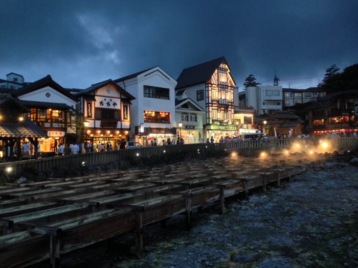 Kusatsu, one of Japan's most renowned Onsen resorts. In the foreground is the 'Yubatake', where steaming hot volcanic water flows through.