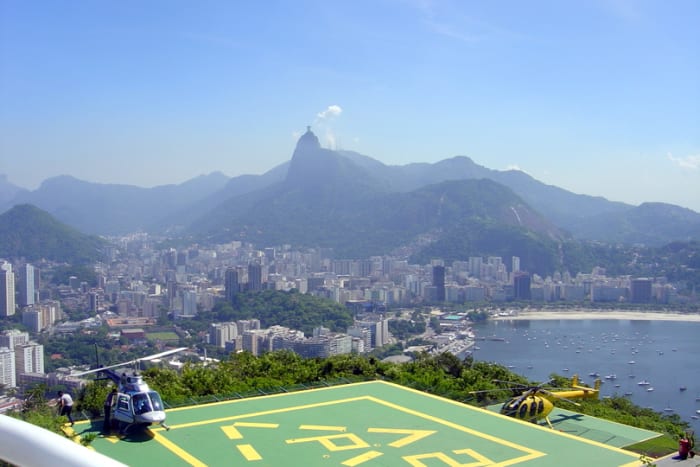 A heliport for sightseeing helicopters overlooks Centro (the downtown area), Botofogo Bay and neighborhood, and Cristo Redentor on Corcovado Mountain (on the far horizon, center).