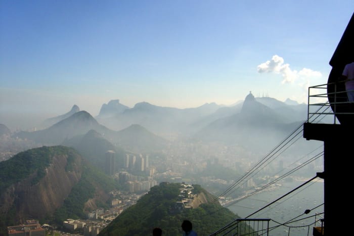 View of Botafogo Neighborhood, Rio from the cable car atop Sugarloaf Mountain. A foggy view of Centro (downtown Rio), Cristo Redentor (Christ the Redeemer) on the horizon at right, and the Botafogo neighborhood.