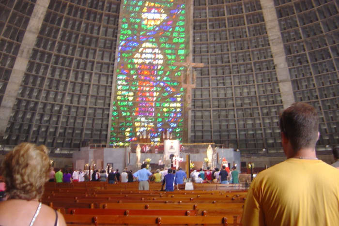 Parishioners and travelers alike worship in the Metropolitan Cathedral of San Sebastian with reverence in the impressive modern space as the Bishop conducts services.