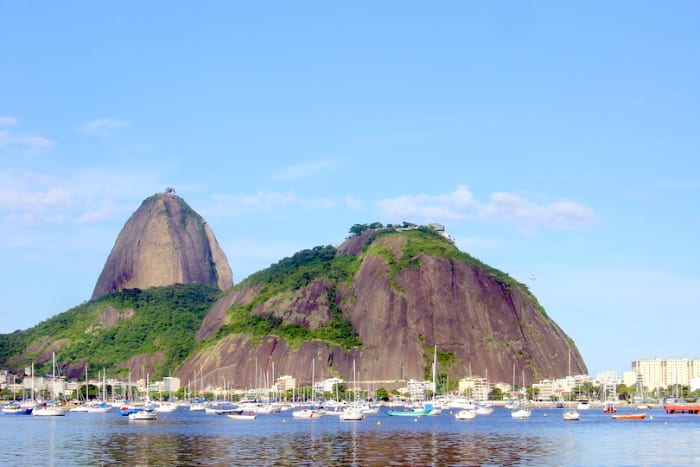 Pão de Açúcar (Sugarloaf Mountain) and Morro da Urca (the Hill of the Cargo Ship), overlooking private pleasure boats harbored in Botafogo Cove of Guanabara Bay.