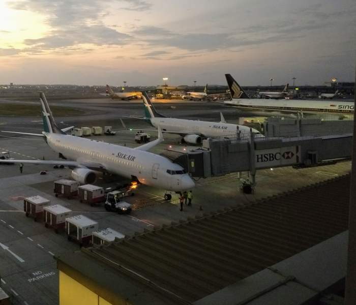 Although we could hear the jets taking off and landing outside the room, they sounded like the rumble of distant thunder.