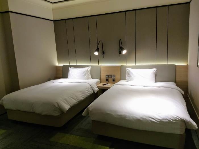 When you first enter the room, the two double beds are on the right.