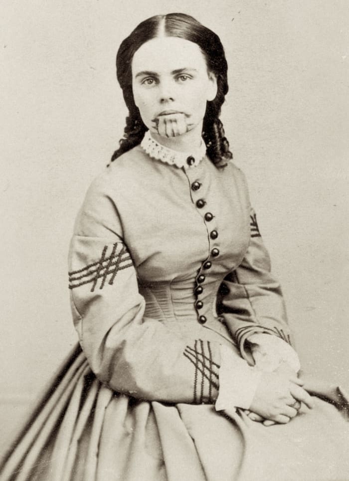 WikiPedia Photo of Olive Oatman from about 1863 about 7 years after her release from captivity. Note the blue tattoo on her chin—a symbol of her being a member of the Mojave tribe.