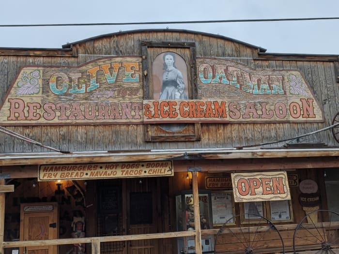 Picture of Olive Oatman above the "Olive Oatman Restaurant & Ice Cream Saloon"