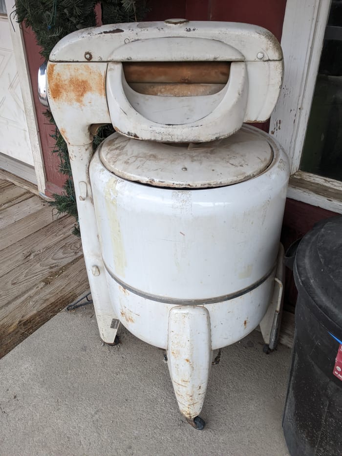 Washing machines like this one our grandmothers used to use. It was better than washing by hand, but it had to be filled manually then drained and refilled to rinse, then run through ringer on top to wring out before hanging wash outside to dry.