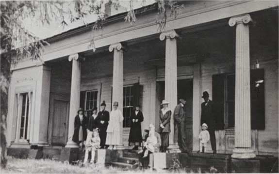 A family picture of the front porch of Swift’s Mansion on Gore Orphanage road. There is no information on who the people were, or when this photo was taken.