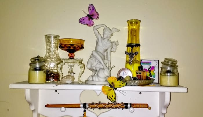 As a freelance writer, I felt compelled to keep a shrine to the God of communication and writing above my workdesk on a small shelf.