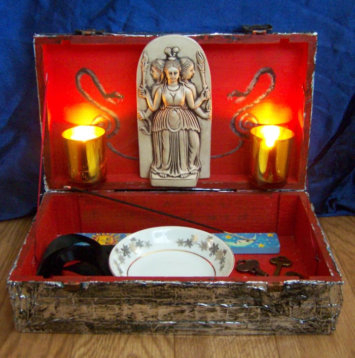 This shrine built into a box is convenient as I can pack it up when necessary and take it with me. If you live with people and don't feel comfortable keeping your shrine out in the open, this is a great solution.