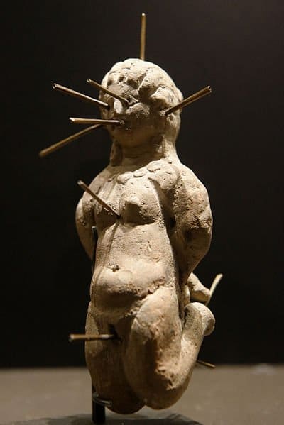 This 4th century doll was found in a terracotta jug with a tablet that bore a binding spell. This is known as 'sympathetic magic' - the doll is linked to the person on whom you cast the spell.