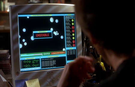 "Courtesy of the movie Hollow Man....Kevin Bacon checking out whether an atomic structure will be stable or not....the fake gui of course giving a great big 'unstable' sign." To really drive the point home, Kevin Bacon sighs and clutches his head.