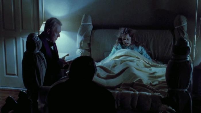 Fathers Lankester Merrin (Max Von Sydow) and Damien Karras (Jason Miller) with Regan MacNeil (Linda Blair)