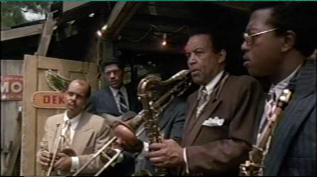 The sound of an anointed song coming from a nearby church causes the band at Harpo's juke joint to stop playing.