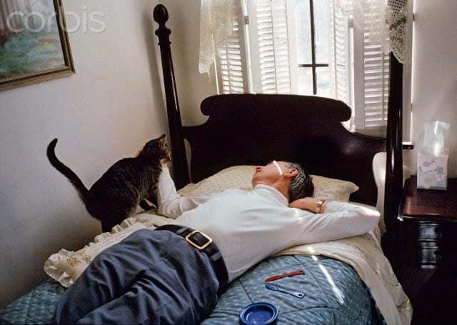 Fred McFeely Rogers taking a much-needed rest with his friend, a pet cat