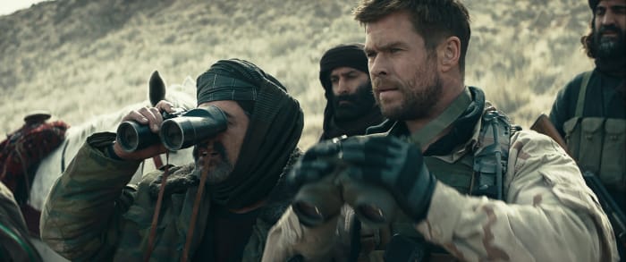 Navid Negahban and Chris Hemsworth star in "12 Strong." Here they can be seen searching for better films to be a part of.