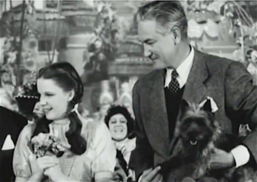 Dorothy Garland, Victor Fleming, and Toto. The llittle dog had millions of worldwide fans after accompanying Dorothy on her journey to the Emerald Kingdom in The Wizard of Oz.