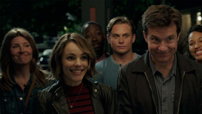 The Main Cast of Game Night (from left: Sharon Horgan, Rachel McAdams, Lamorne Morris, Billy Magnussen, Jason Bateman, and Kylie Bunbury