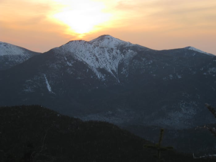 Walking at sunset is a great way to start a night hike. This picture, the setting sun over the Adirondack Great Range.