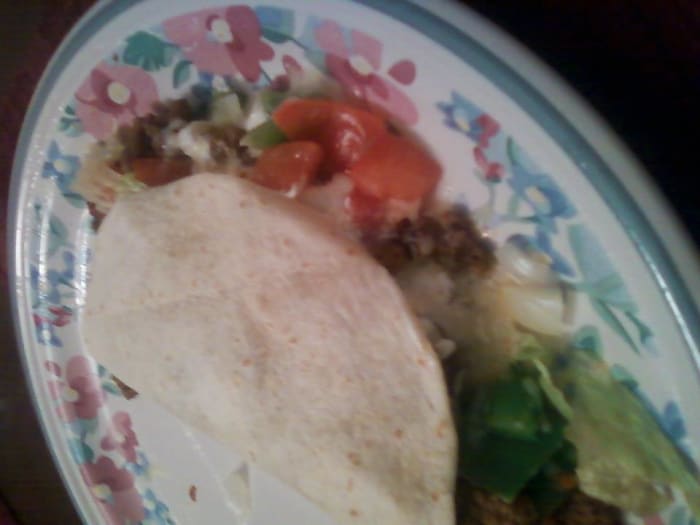 A soft taco including ground beef, cheese, tomatoes, lettuce, green peppers and onion. This whole taco can go right into the blender for an easy, tasty, blended meal.