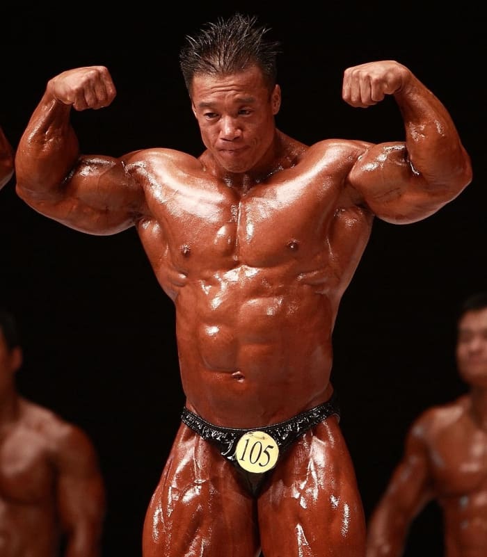 Korean bodybuilder Park Ki Seok (박기석) doing a double biceps pose at the 2009 National Sports Festival
