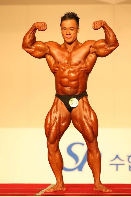 Korean bodybuilder Park Ki Seok (박기석) doing a double biceps pose at the 2012 National Sports Festival
