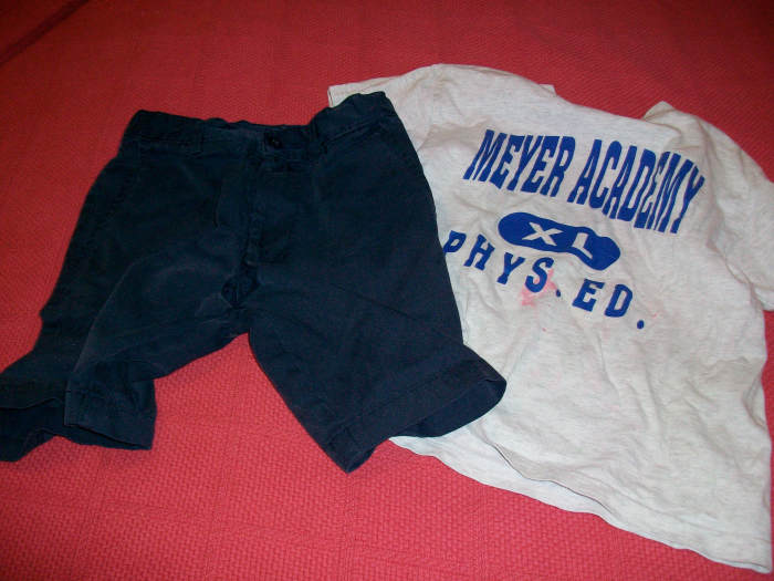 What NOT to donate. Note the mysterious pink stains on the shirt and the hole in the crotch of the shorts. How do these things even happen?