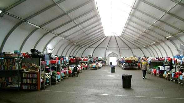 This image from a fabric shelter website shows a slight variation on current bed layouts for homeless shelters. Typically the beds would span the floor, no privacy or security while you sleep, which creates a danger to those sleeping there.
