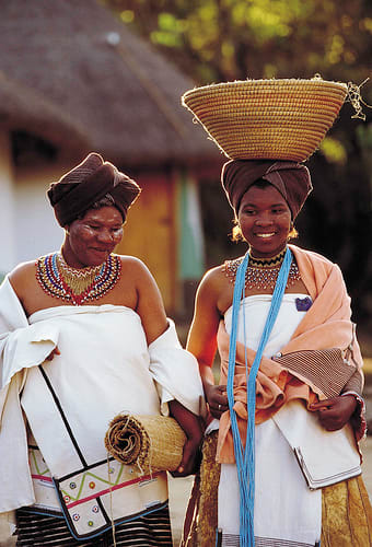 In the old days, a girl would go bare-breasted until she married. Until then, a young woman of marriageable age may wear a head cloth and skirt, but no apron. Only on marriage would she be permitted to cover her breasts. An apron of sheep or antelop