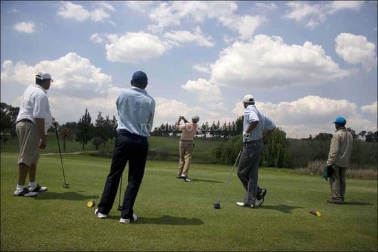 Black elites takes a swing during a game of golf with his friends at the Louewkop Golf Course in Sunninghill, Johannesburg, South Africa.