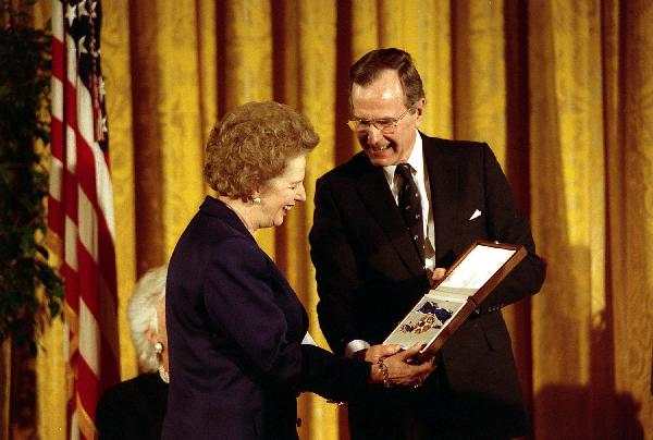1991. U.S. President George H. W. Bush awards former U.K. Prime Minister Margaret Thatcher with the Presidential Medal of Freedom, the highest civilian honor awarded by the United States.