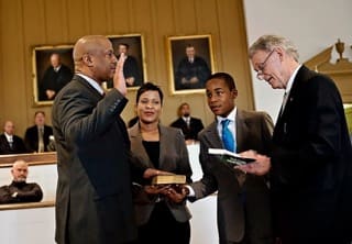 In 2012, Alex was sworn in as the first African American Sheriff of Chester County, S.C. with his wife Angel and son T.J. by his side.