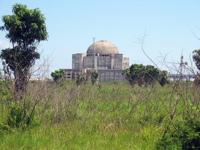 A young mango tree, on the left, defies the desolation produced by the construction of a now abandoned nuclear power plant.
