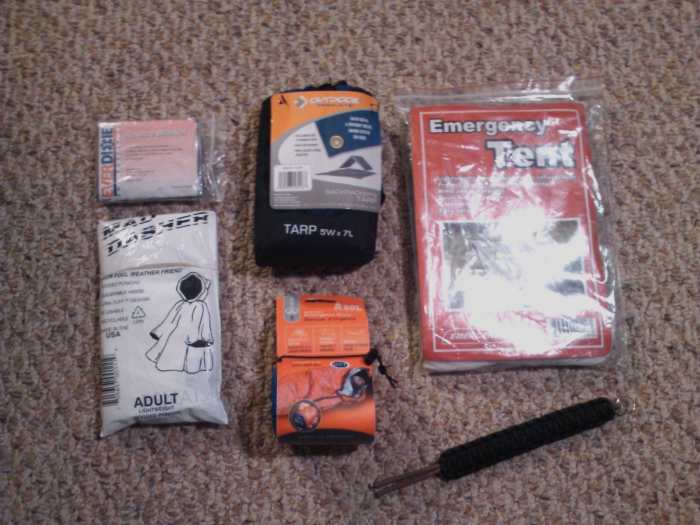 From left to right: rescue blanket, emergency tarp, emergency tent, poncho, emergency bivvy, and parachute cord.