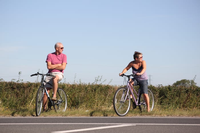 Summer is a great time to ride your bike and you shouldn't worry a gentle ride will build huge thighs. It will have a far better effect on your health.