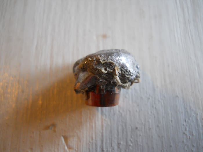 260 grain, .375 AccuBond recovered from green wood. Note perfect mushroom. Bullet held together at over 2600 fps impact velocity. and penetrated more than 11 inches. 90% weight retention.