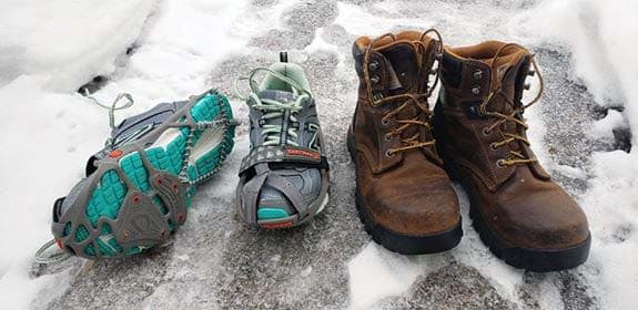 On the right are New Balance running shoes with Yak Trax. The Trax should be better centered on the toe, but they worked for now. On the left are the work boots from Carhartt that double as winter and hiking boots. I wear extra socks in winter.