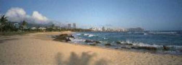 Sand Island State Recreation Area, available for camping with a view of Honolulu, HI, in the background