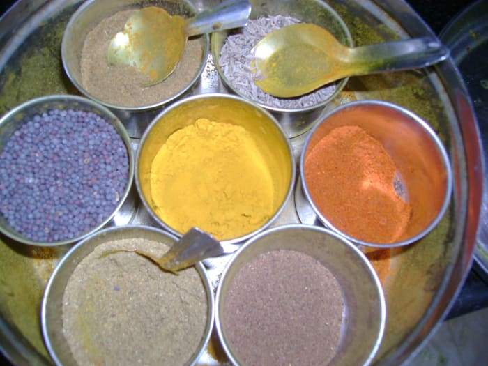 Cumin seeds in my masala box - the one with the big spoon in it :) The one next to it with the spoon is the powdered cumin